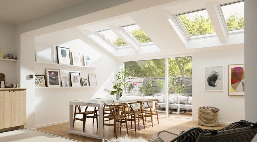 velux extension with four white roof windows